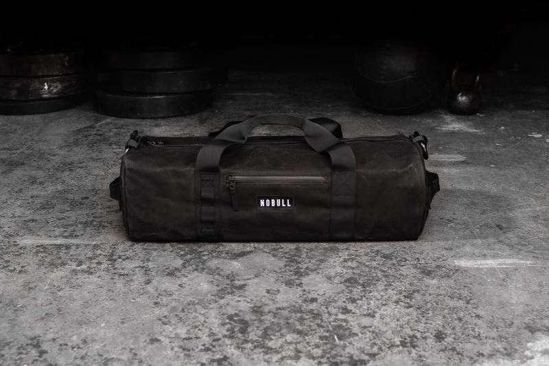 Black Men's Nobull Waxed Canvas Traditional Duffle Bags | VKWIDS-219